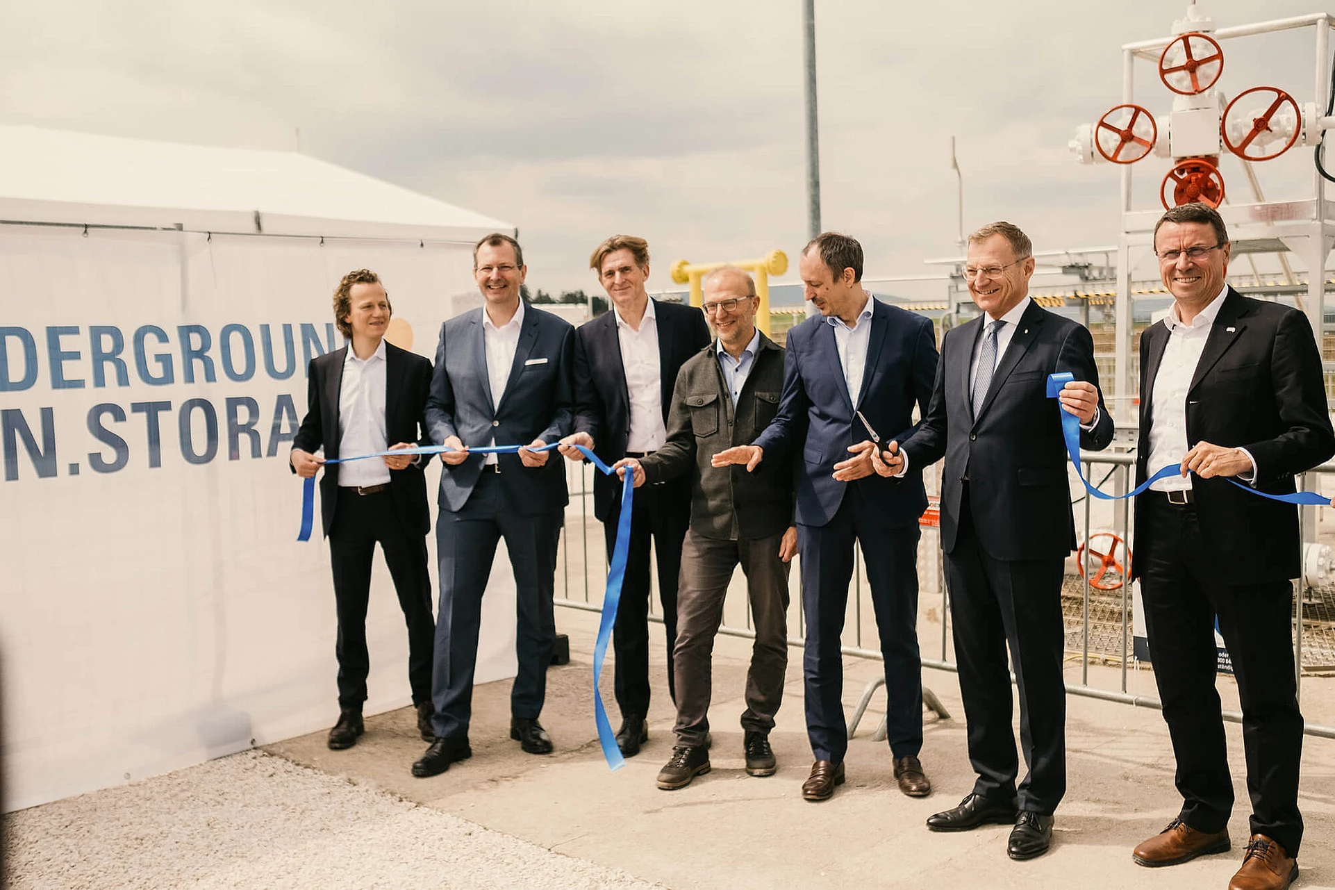 Cutting through the ribbon at the opening