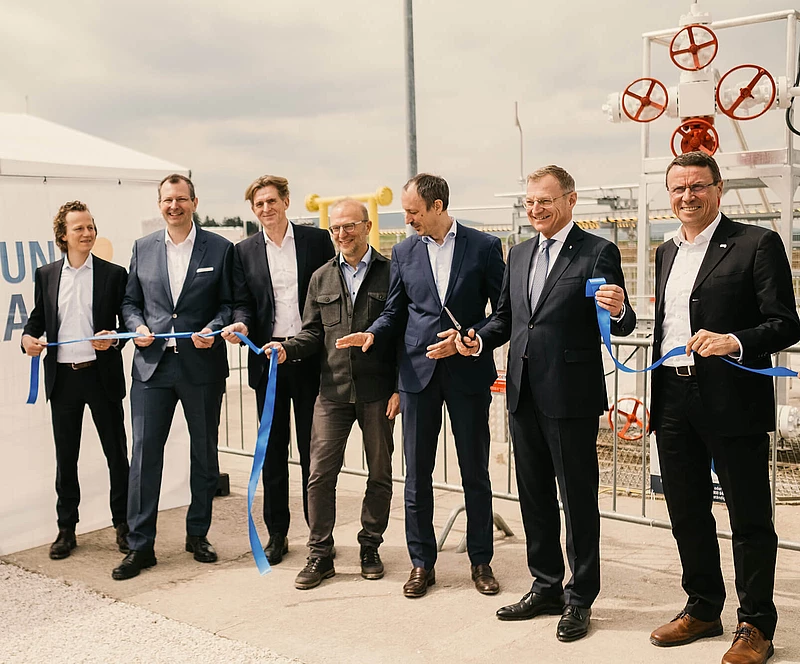 Cutting through the ribbon at the opening