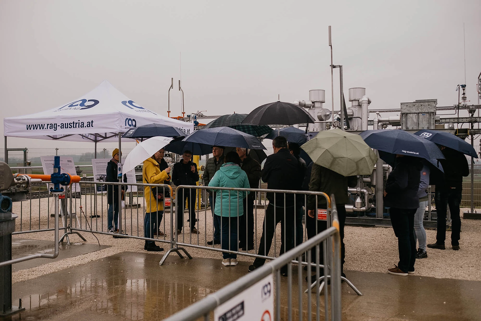 Visitors with umbrellas at residents and information day